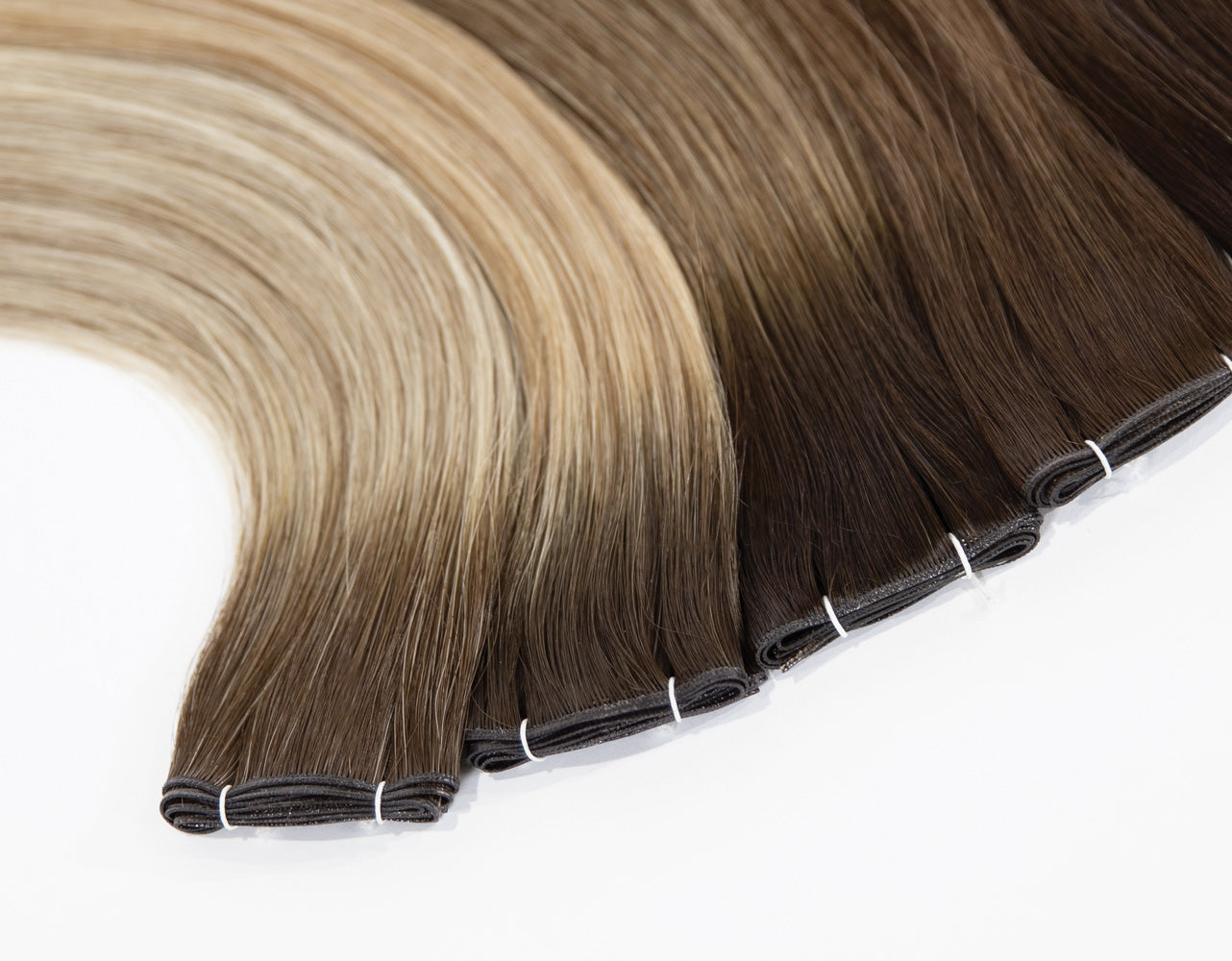 DS HAIR Genius Weft extension range showing blonde and brunette shades