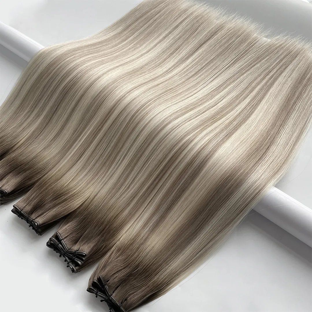 Blonde Genius Weft hair extensions showing smooth length and tonal blend