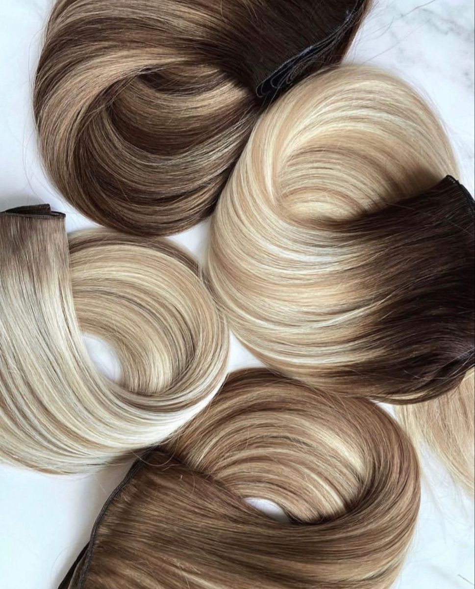 Blonde and brown machine weft bundles arranged for colour matching