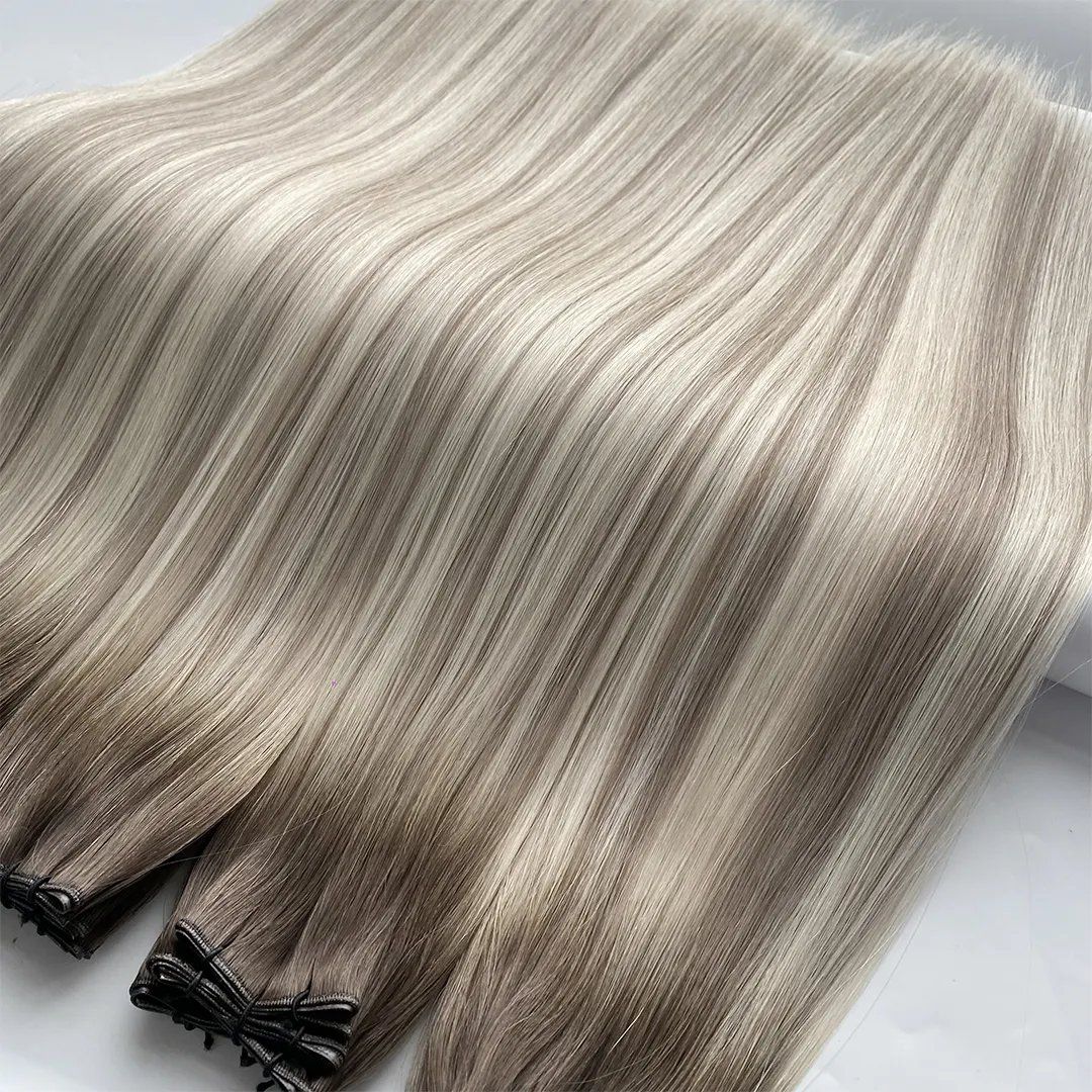 Ash-blonde double-drawn machine weft bundles showing full end density