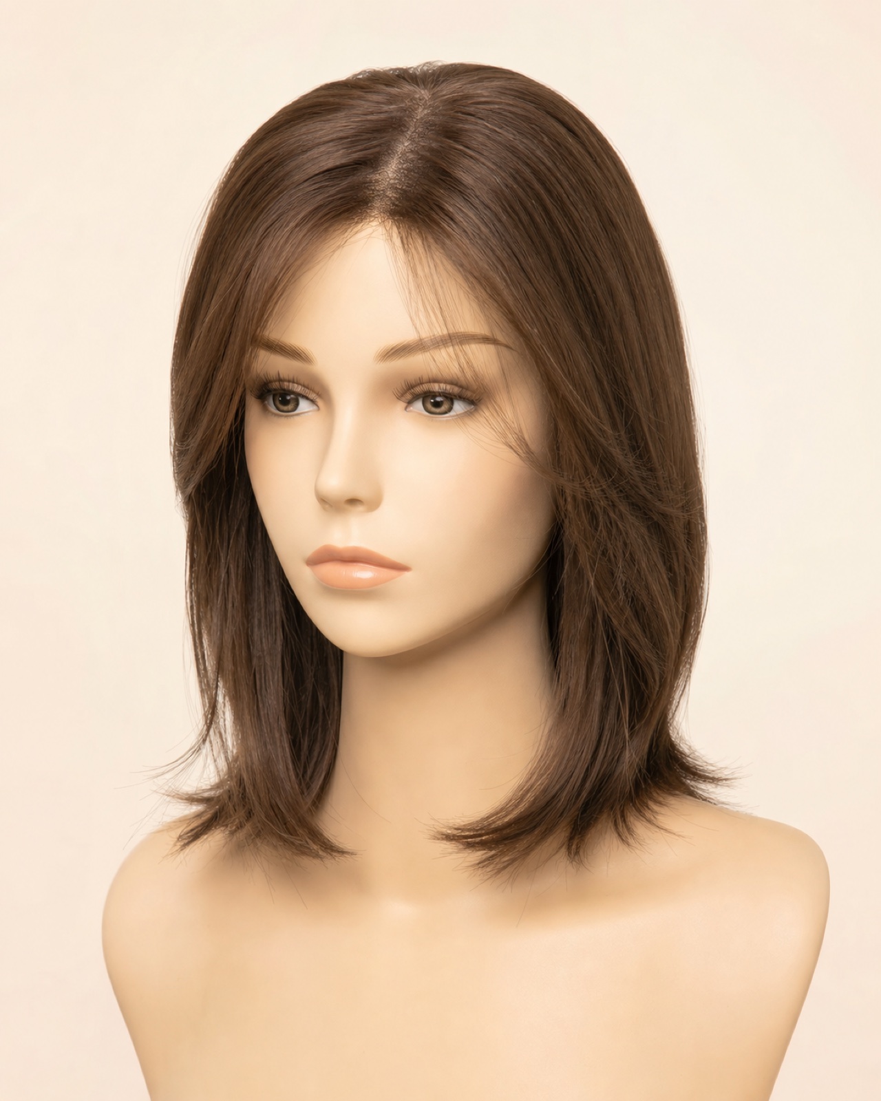 Layered synthetic clip-in crown topper displayed on a salon mannequin