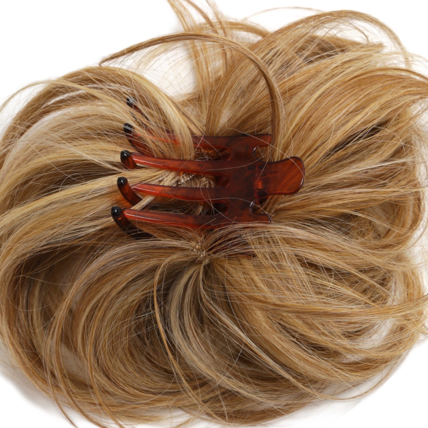 Close-up of the claw clip attachment on a synthetic chignon hairpiece