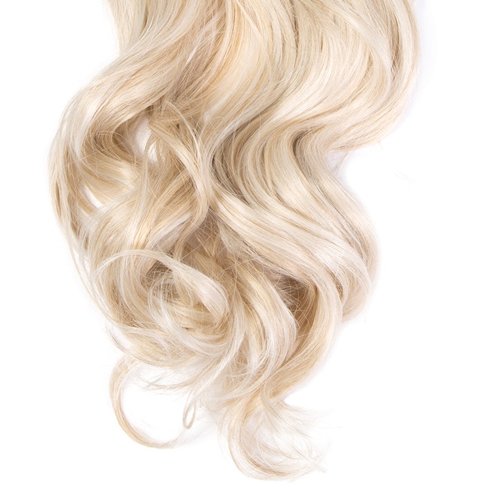 Close-up of the soft flowing curl texture on the synthetic ponytail