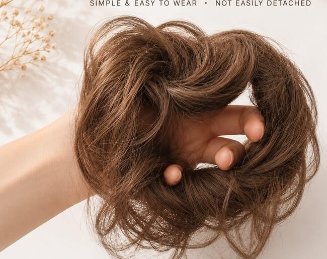 Elastic-band attachment detail inside a synthetic hair bun scrunchie